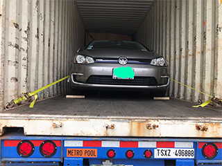 car in shipping container