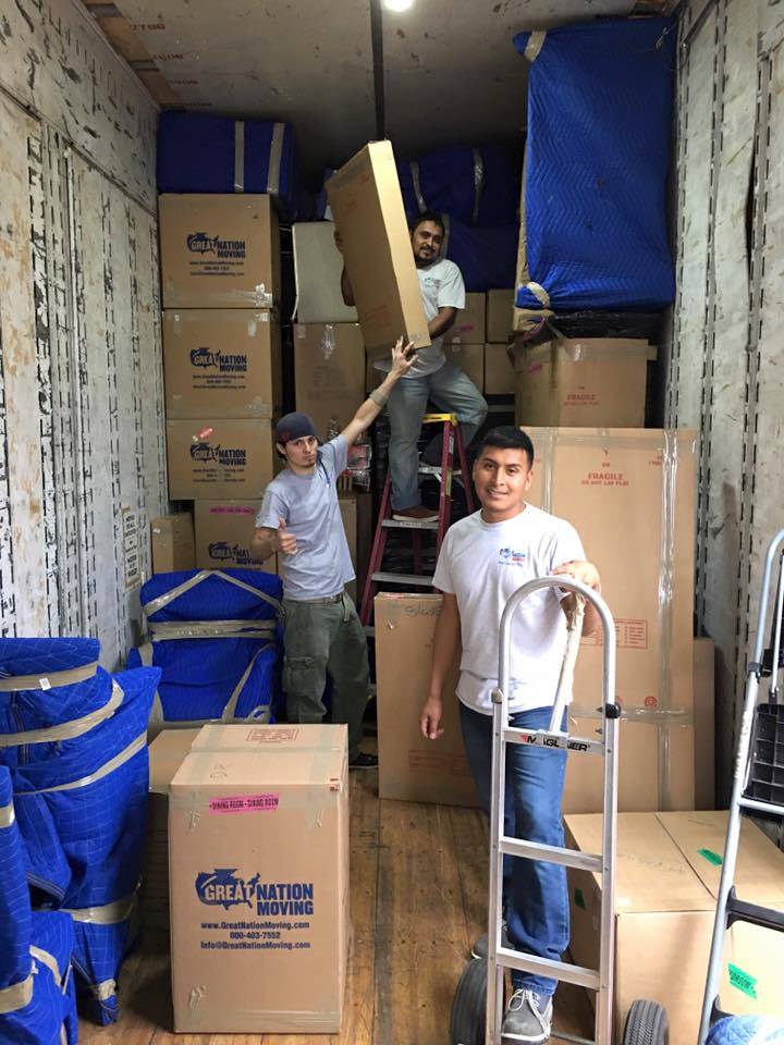 Our workers moving packed stuff